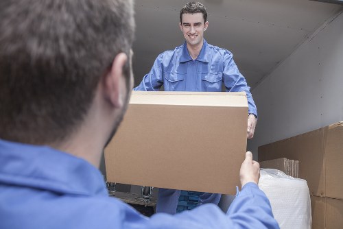 Moving boxes and packing materials prepared for a home move in Holland Park