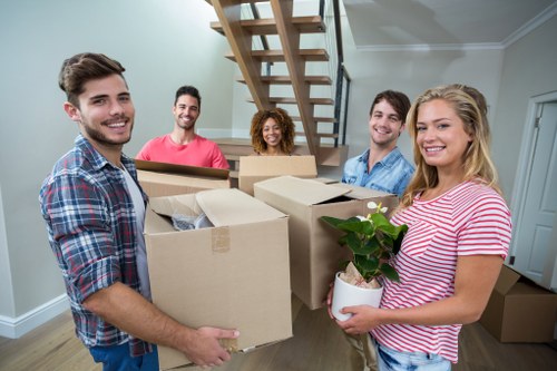 Student removal van service in Holland Park with boxes and furniture ready for collection