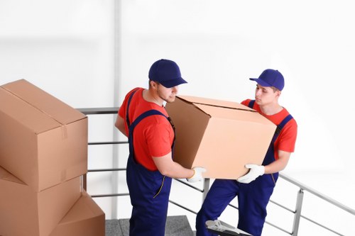 Packed boxes and furniture prepared for transport in Holland Park