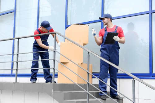 Commercial removal service preparing office furniture for transport