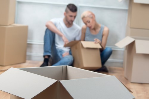 Professional movers loading boxes and furniture for a local relocation