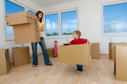Packed boxes and furniture ready for a Holland Park flat removal service