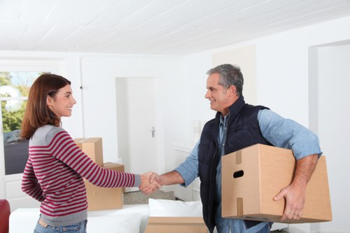Unpacking boxes in a Holland Park apartment after a move