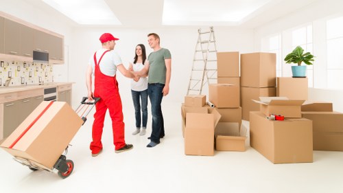 Local office movers handling desks and equipment near Holland Park