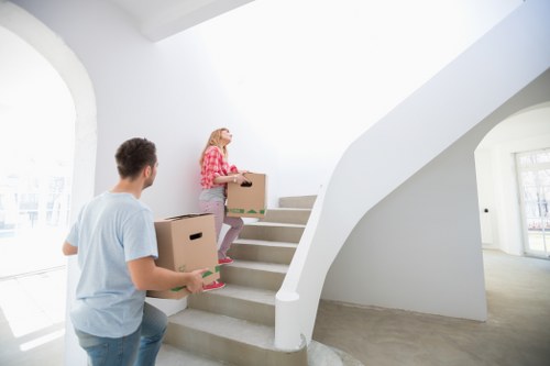 A moving team handling office equipment in Holland Park