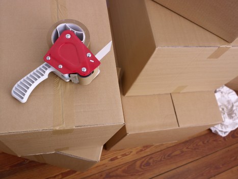 Careful loading of boxes and furniture during a Holland Park house removal