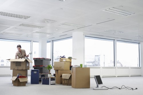 Furniture and office equipment being prepared for a Holland Park move