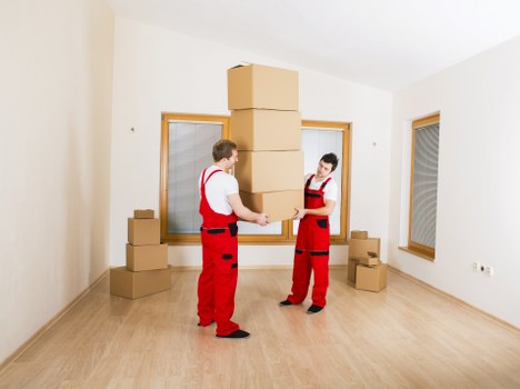 Student furniture and boxes being moved from a period property near Holland Park